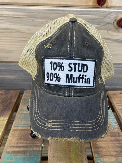 brown baseball cap that reads 10% Stud 90% Muffin